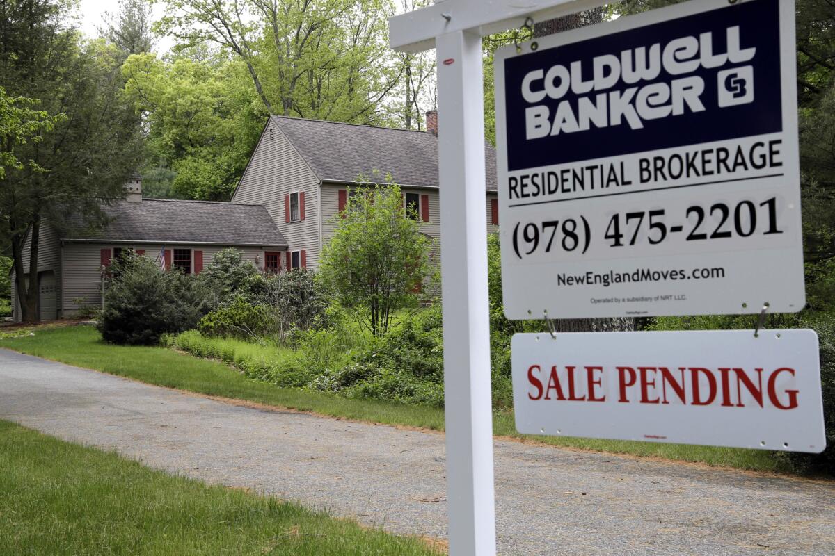 A home in North Andover, Mass., displays a "sale pending" sign this week.