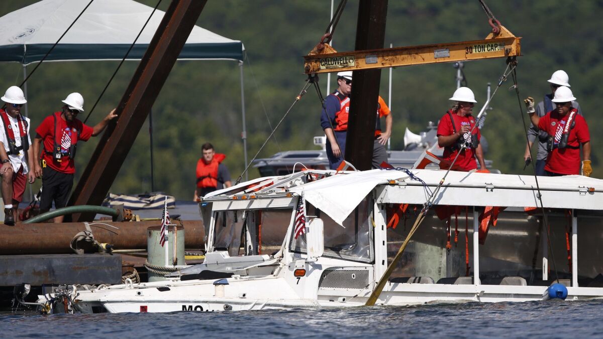 The duck boat that sank in an accident that killed 17 people is raised on Monday.