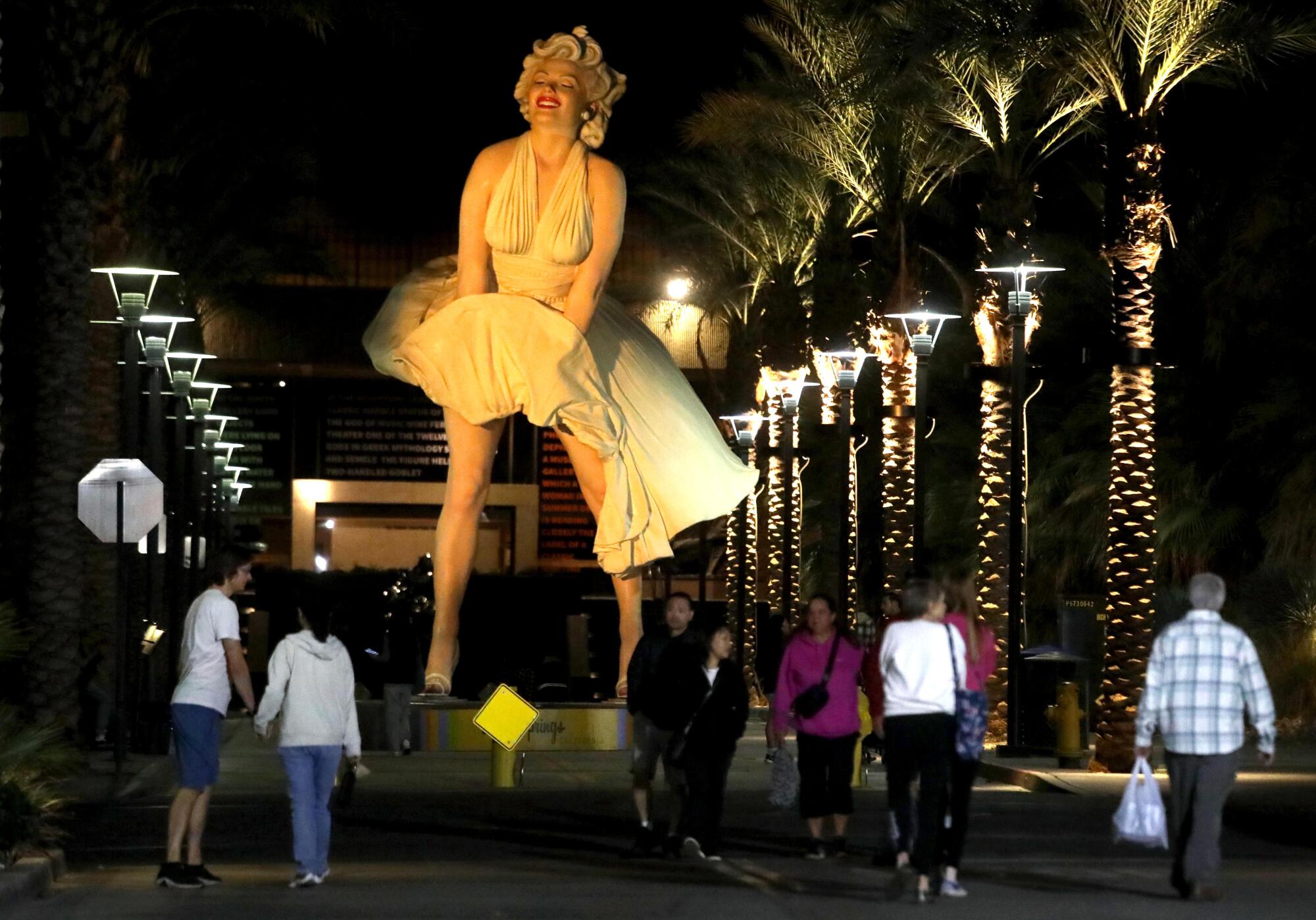 The "Forever Marilyn" giant statue towers over attendees at the weekly Palm Springs Village fest along Museum Way.