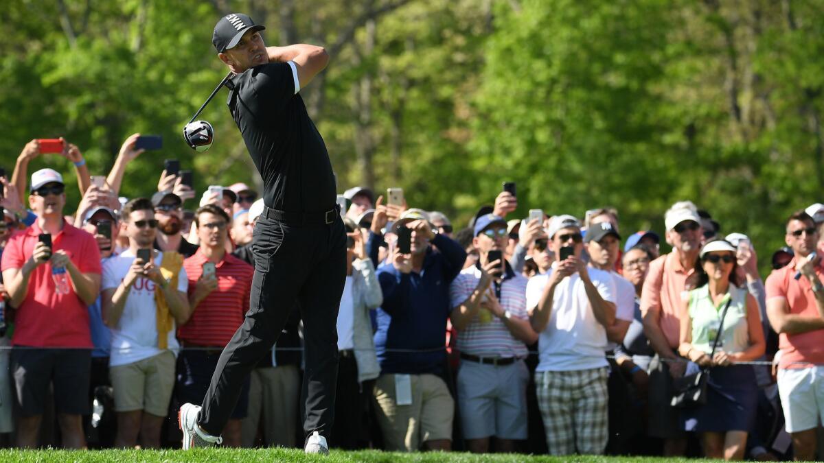 Brooks Koepka hits from the sixth tee during the third round of the PGA Championship on May 18.