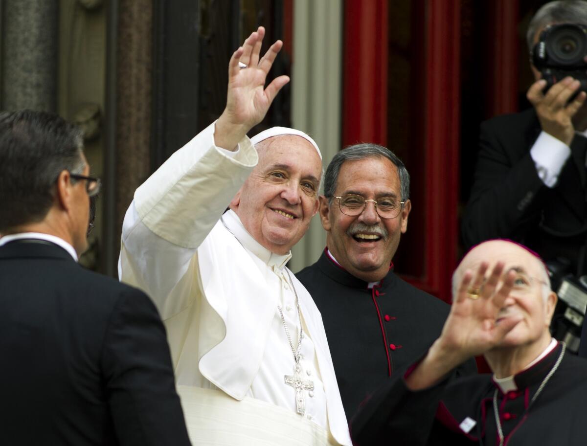 Pope Francis waves to the crowd upon his arrival at St. Patrick's Church in Washington on Thursday, Sept. 24.