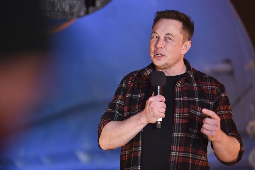 Elon Musk, co-founder and chief executive officer of Tesla Inc., speaks during an unveiling event for the Boring Co. Hawthorne test tunnel in Hawthorne, Calif., on Tuesday, Dec. 18, 2018. Musk has unveiled his underground transportation tunnel, allowing reporters and VIPs to take some of the first rides in the subterranean tube, which the tech entrepreneur says is the answer to what he calls "soul-destroying traffic." (Robyn Beck/Pool Photo via AP)