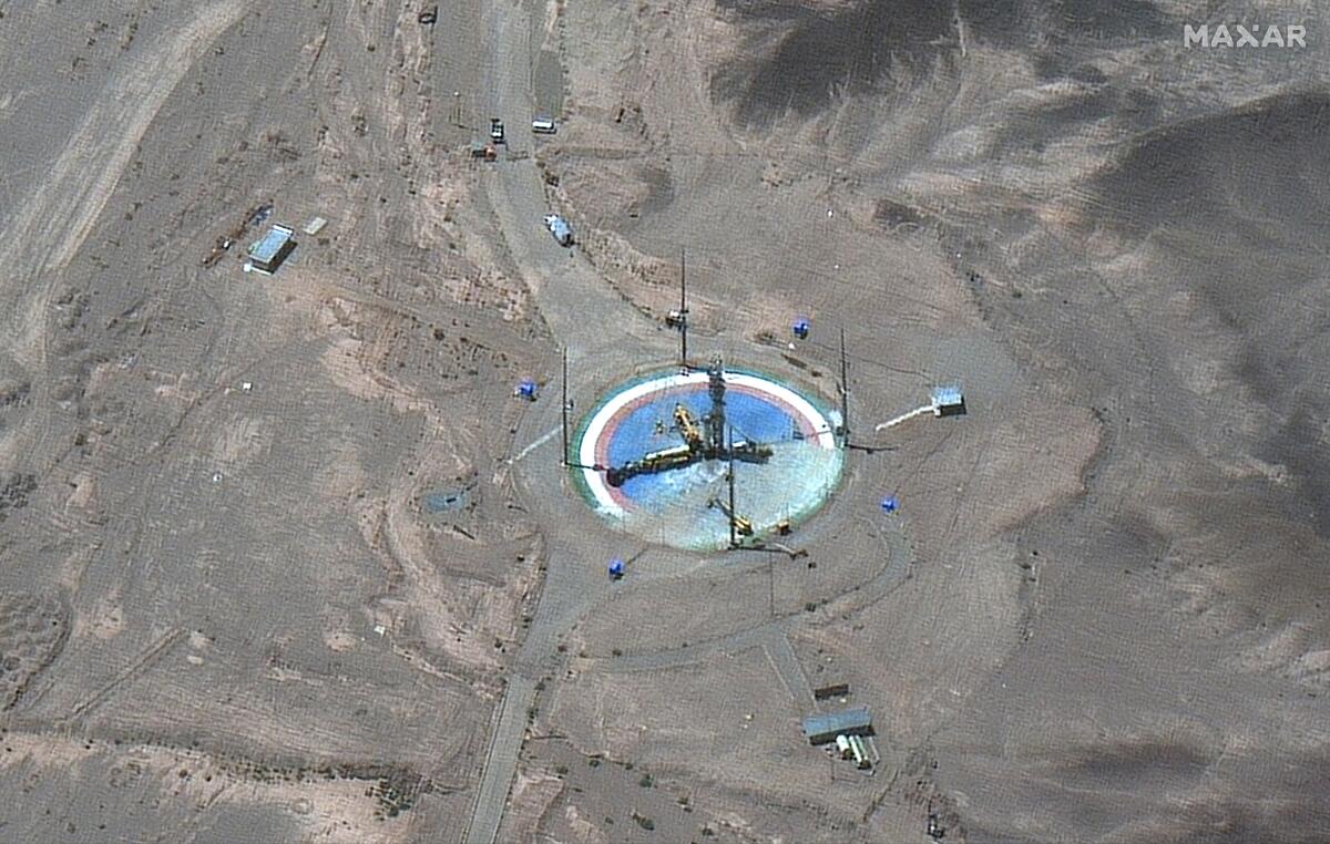 This satellite image from Maxar Technologies shows a rocket preparing to be erected at a launch pad at Imam Khomeini Space Center southeast of Semnan, Iran on Tuesday, June 14, 2022. Iran appeared to be readying for a space launch Tuesday as satellite images showed a rocket on a rural desert launch pad, just as tensions remain high over Tehran's nuclear program. The images from Maxar Technologies showed a launch pad at Imam Khomeini Spaceport in Iran’s rural Semnan province, the site of frequent recent failed attempts to put a satellite into orbit. (Satellite image ©2022 Maxar Technologies via AP)