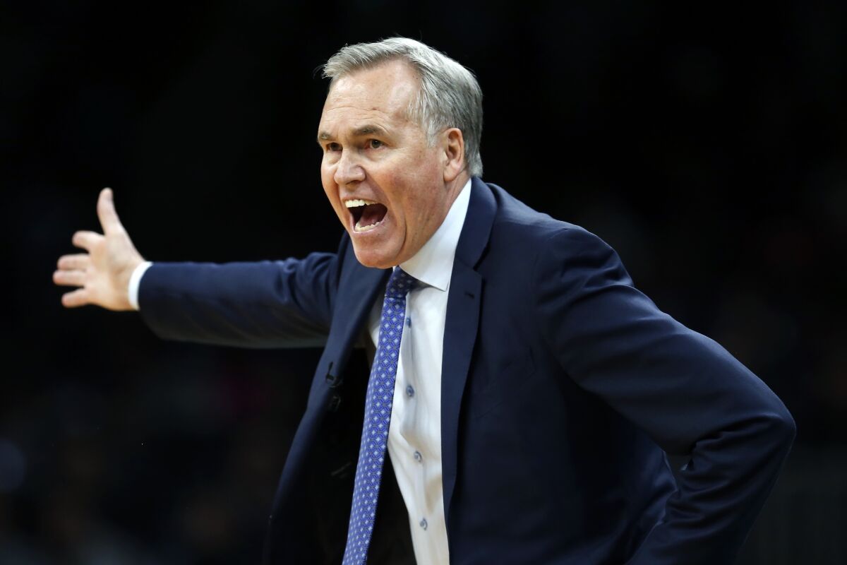 FILE - Mike D'Antoni, then coach of the Houston Rockets coach, reacts to a call during the first half of the team's NBA basketball game against the Boston Celtics in Boston on Feb. 29, 2020. The Charlotte Hornets have begun their search for a head coach, asking permission to speak with several candidates, said a person familiar with the situation. The person says the list includes two-time NBA coach of the year and New Orleans Pelicans consultant D’Antoni. (AP Photo/Michael Dwyer, File)