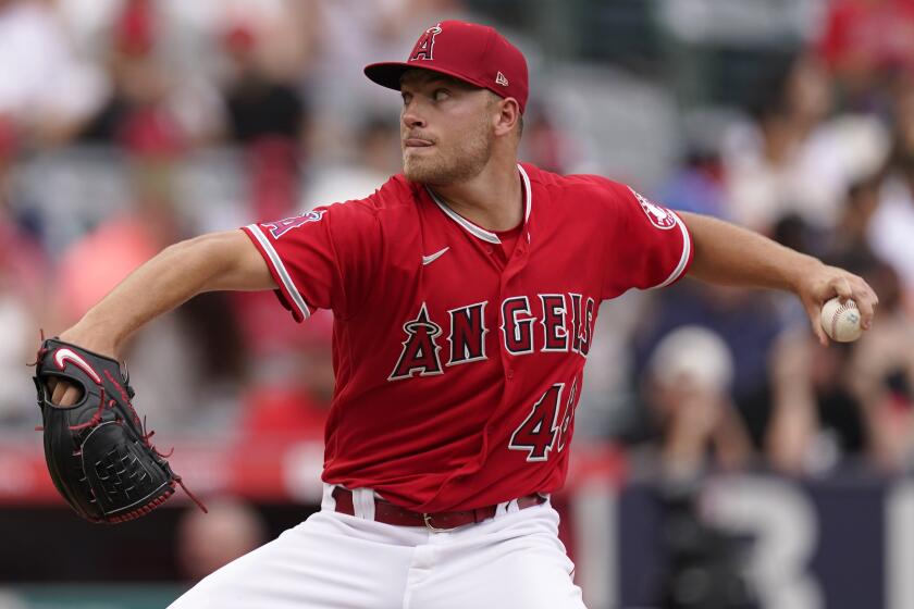 Los Angeles Angels starting pitcher Reid Detmers throws to the plate during the second inning.
