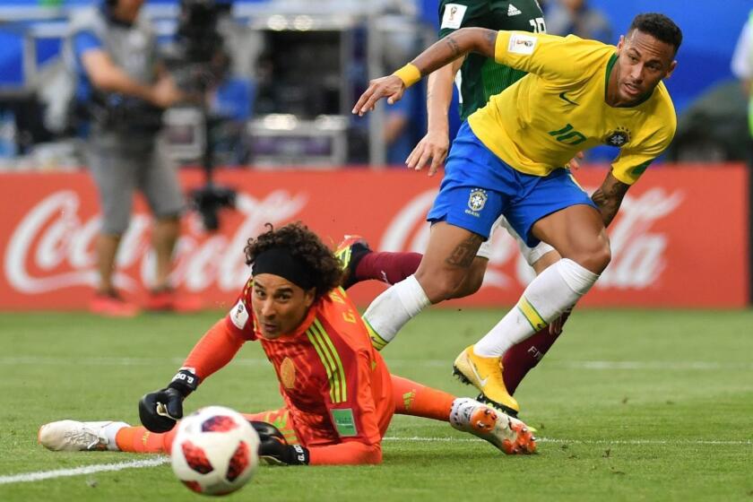 Brazil's forward Neymar passes the ball to Brazil's forward Roberto Firmino for the team's second goal during the Russia 2018 World Cup round of 16 football match between Brazil and Mexico at the Samara Arena in Samara on July 2, 2018. / AFP PHOTO / Fabrice COFFRINI / RESTRICTED TO EDITORIAL USE - NO MOBILE PUSH ALERTS/DOWNLOADSFABRICE COFFRINI/AFP/Getty Images ** OUTS - ELSENT, FPG, CM - OUTS * NM, PH, VA if sourced by CT, LA or MoD **