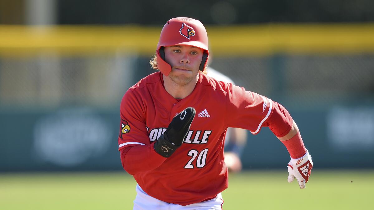 Louisville's Dalton Rushing sprints to third base during a game against Connecticut in February.