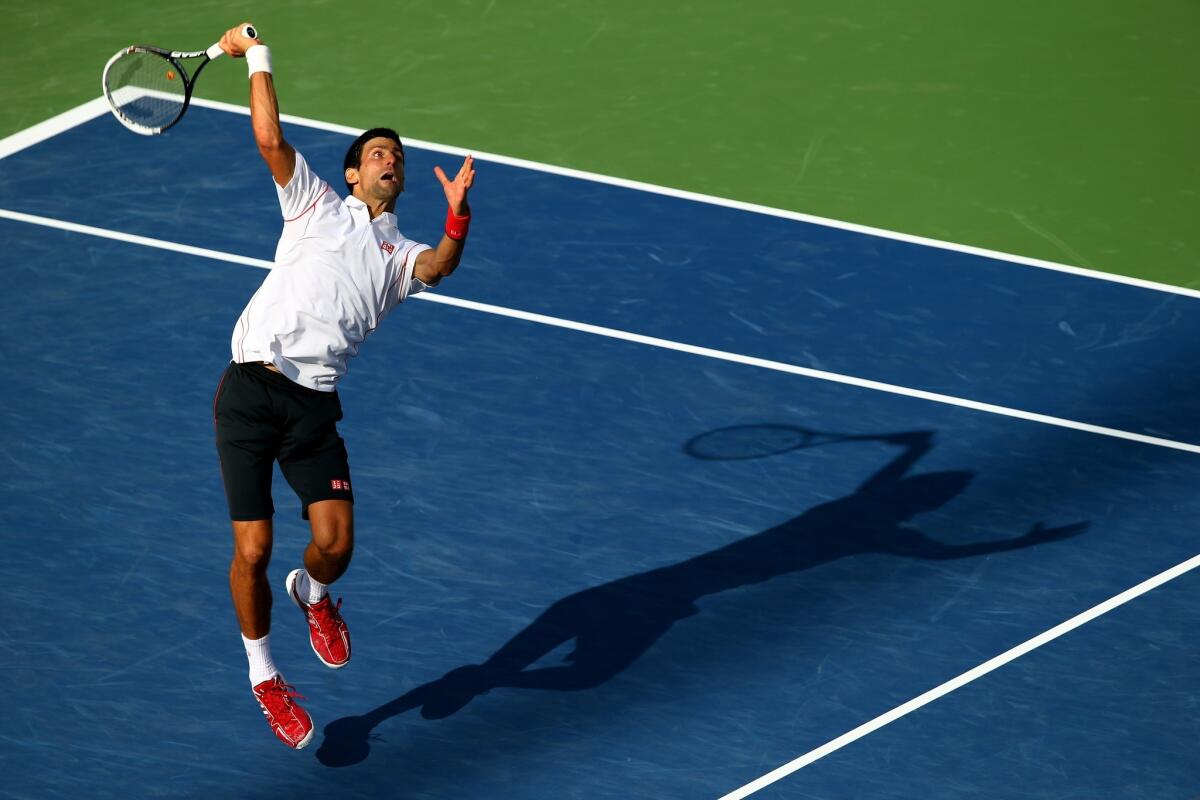 Novak Djokovic serves during his semifinal victory over Stanislas Wawrinka at the U.S. Open on Saturday.