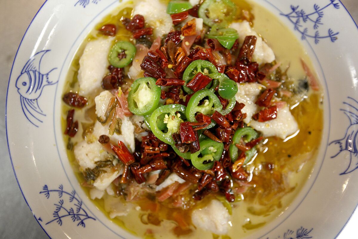 The house special fish stew with Szechuan pickles and topped with chiles.