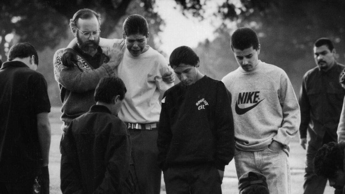 In February 1990, Father Gregory Boyle, along with members of the Carence Street Locos, went to visit the grave of a fellow gang member who had been killed a few weeks earlier.