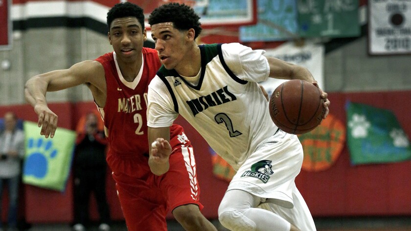 Chino Hills' Lonzo Ball drives past Mater Dei's Justice Sueing during their playoff game Friday night at Ayala High.