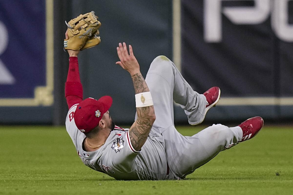 Philadelphia Phillies right fielder Nick Castellanos makes a diving catch in the ninth to force extra innings in Game 1.