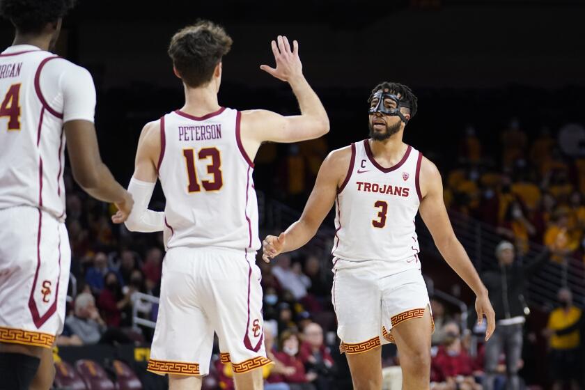 Southern California forward Isaiah Mobley (3) celebrates after scoring during the second half of an NCAA college basketball game against Washington State Sunday, Feb. 20, 2022, in Los Angeles. (AP Photo/Marcio Jose Sanchez)