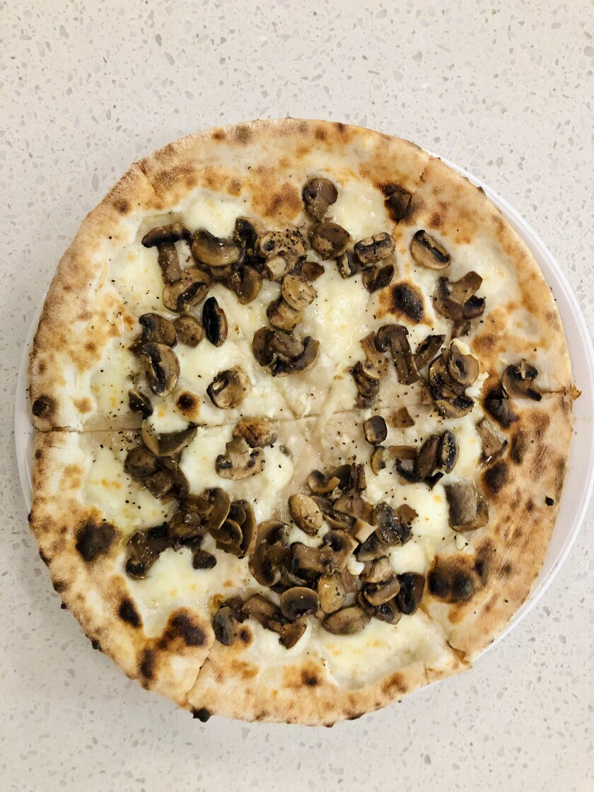 A funghi (mushroom) pizza at Del Lusso Napoletana Pizzeria in Carlsbad.