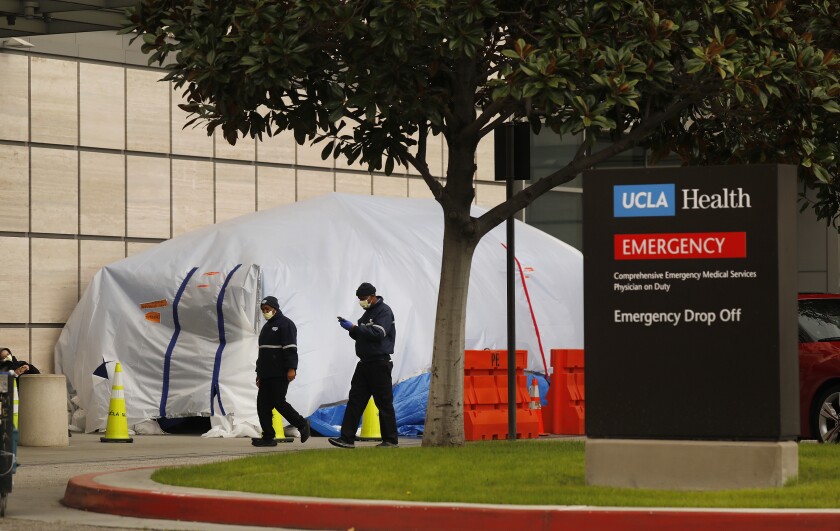 LOS ANGELES, CA - MARCH 17, 2020 Tents have been erected at the Saperstein Emergency Center entrance to the Ronald Regan UCLA Medical Center on the Westwood campus as hospitals are straining under coronavirus but the big wave hasn't hit yet as of March 17, 2020. (Al Seib / Los Angeles Times)