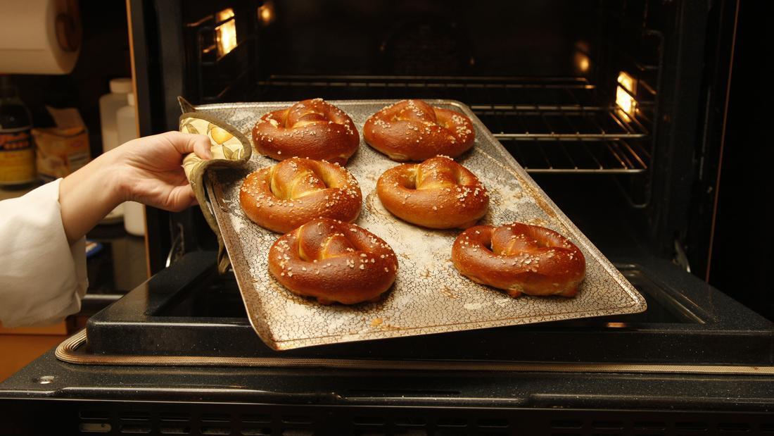 Bake pretzels until puffed and golden brown, about 10 minutes, rotating halfway.