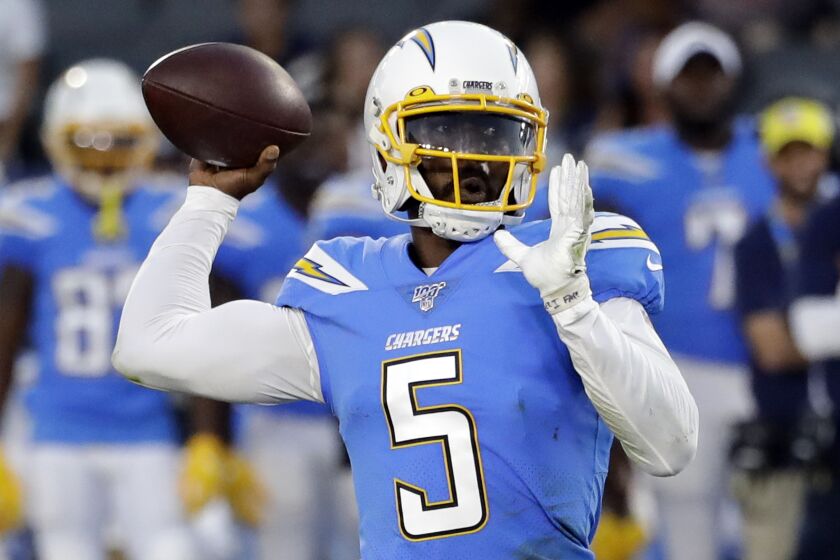 Chargers quarterback Tyrod Taylor throws the ball downfield.