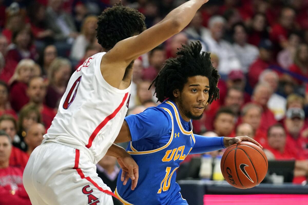 UCLA guard Tyger Campbell drives during the Bruins' 65-52 victory at No. 23 Arizona on Feb. 8, 2020.