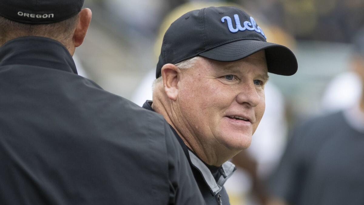 UCLA head coach Chip Kelly roams the field before playing Oregon on Saturday.
