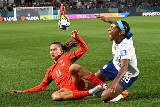 The United States' Crystal Dunn and Portugal's Tatiana Pinto collide as they battle for the ball