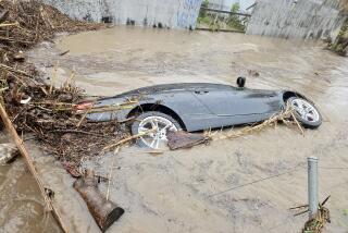Manuel DeLeon's car fully submerged in San Diego's flood waters.