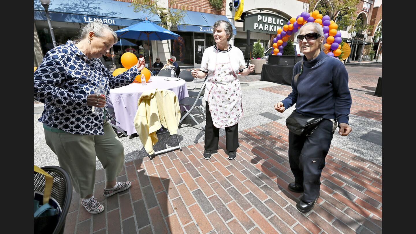 From left, Mary West from Eagle Rock, Carol Tanner of Glendale and Dawn (no last name given), also from Glendale, dance away at the City of Glendale Community Services and Parks first #AgeOutLoud Senior Street Fest, at Maryland Paseo in Glendale on Wednesday, May 17, 2017. The festival celebrates Older Americans Month.