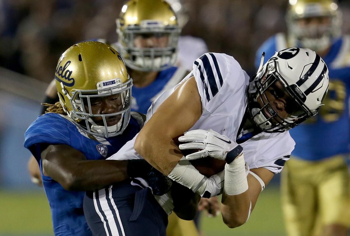 UCLA linebacker Jayon Brown brings down BYU running back Squally Canada in an early season game on Sep. 19.