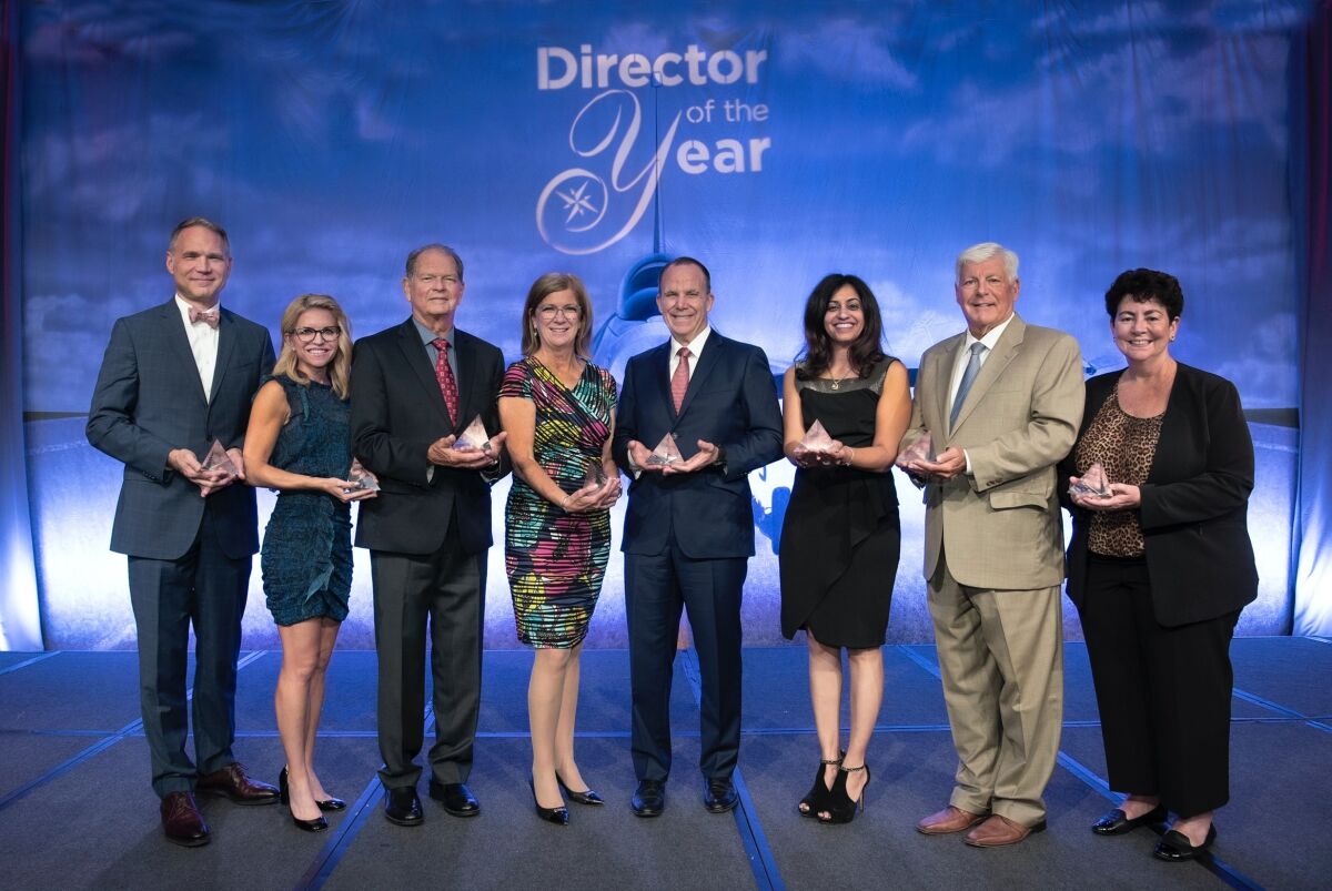 La Jolla Music Society's Todd Schultz, left, at the Corporate Directors Forum's award ceremony.