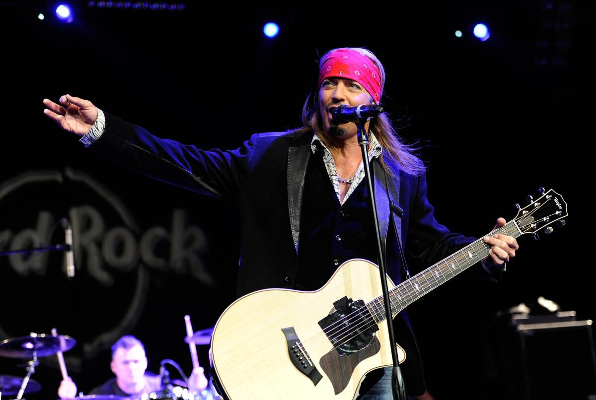 Rock singer Bret Michaels, shown performing in New York in April, rushed off stage in New Hampshire Thursday after experiencing "extremely low blood sugar," according to bandmate Pete Evick.