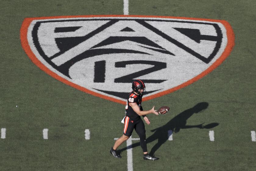 Oregon State long snapper Dylan Black (48) warms up near a Pac-12 logo on the field at Reser Stadium before an NCAA college football game against UC Davis Saturday, Sept. 9, 2023, in Corvallis, Ore. Oregon State won 55-7. (AP Photo/Amanda Loman)