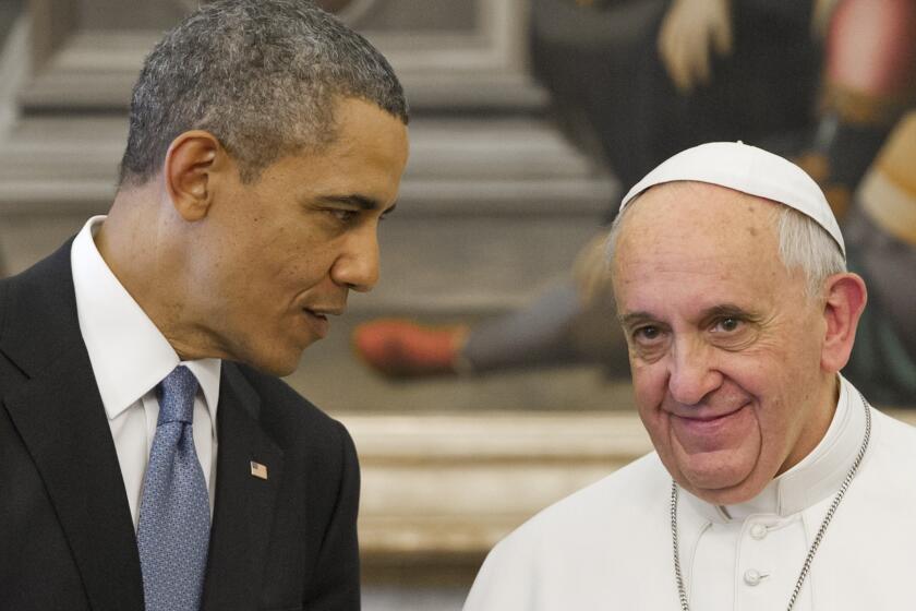 Pope Francis speaks with President Obama during a private audience on March 27 at the Vatican.