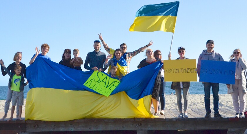 Ukrainian flash mob gathering on Wednesday at Main Beach boardwalk in Laguna Beach. 