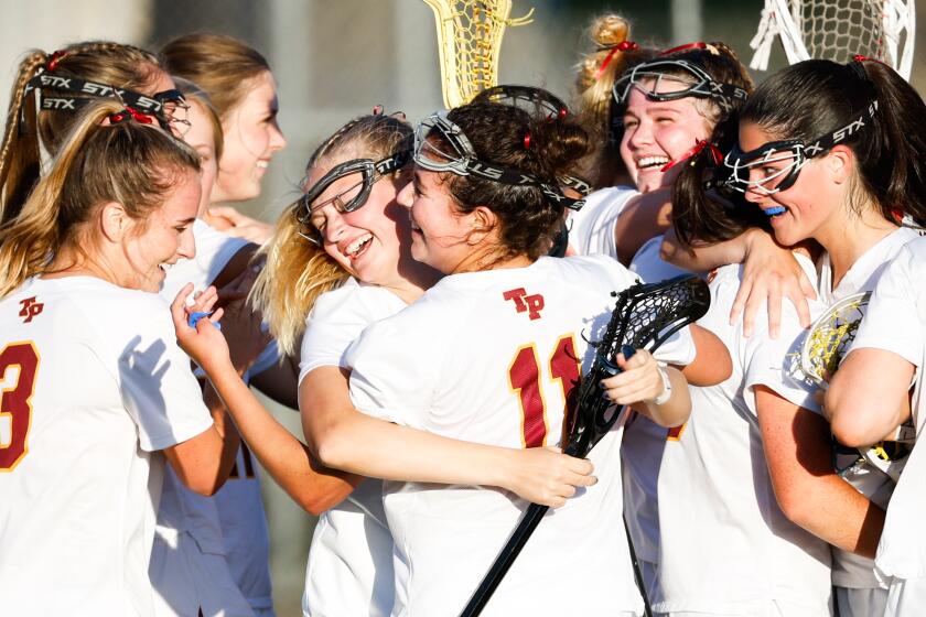 San Diego, CA - May 18: Torrey Pines' players celebrate after beating Coronado during the CIF San Diego Section Open Division Girls Lacrosse Championships at Scripps Ranch High School on Saturday, May 18, 2024 in San Diego, CA. (Meg McLaughlin / The San Diego Union-Tribune)