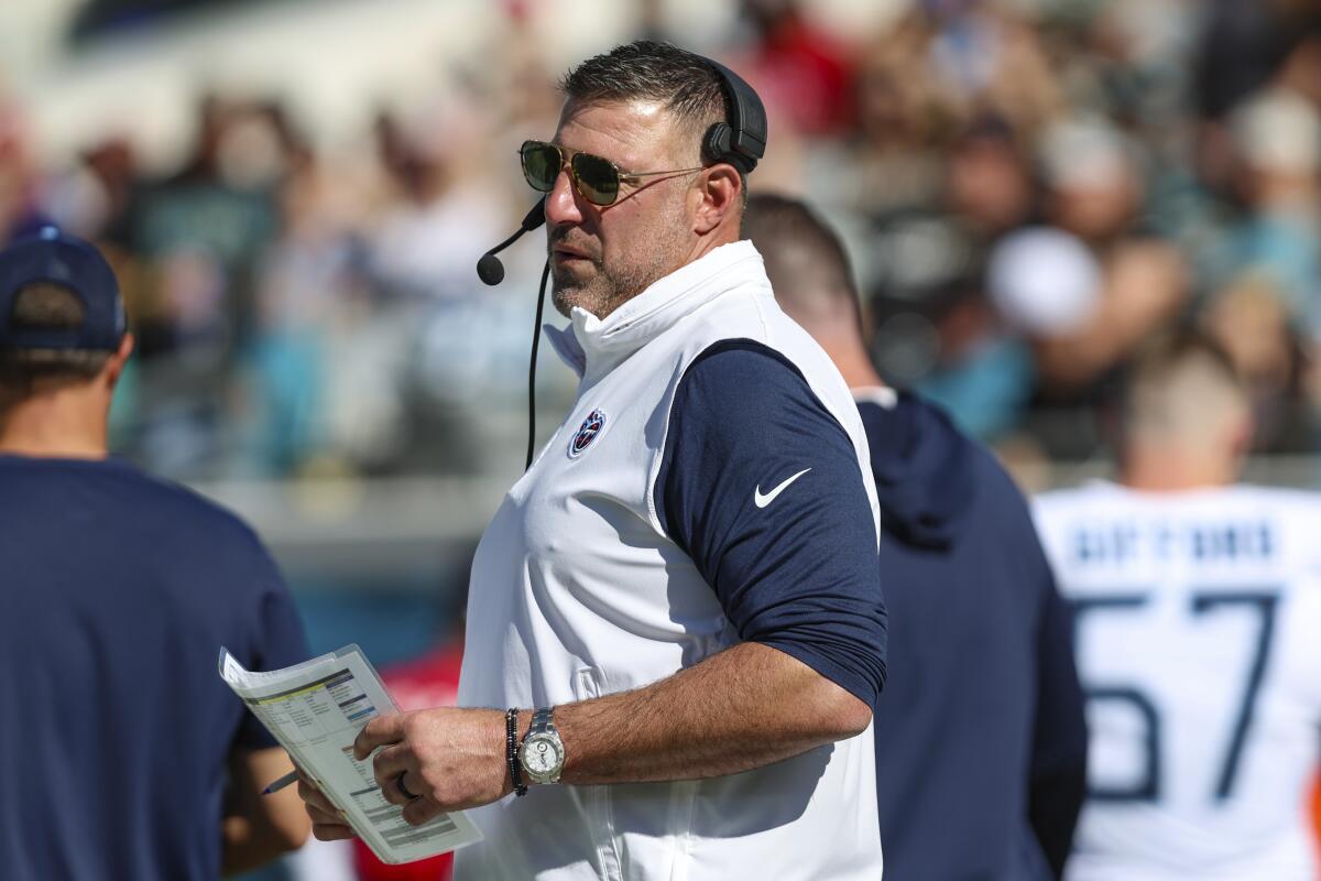 Tennessee Titans head coach Mike Vrabel looks across the field.