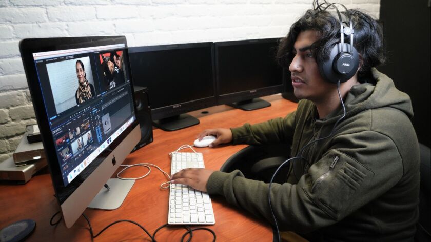 Jesus Villegas, 20, a mentee at the David's Harp Foundation in East Village, is editing one of his video projects.
