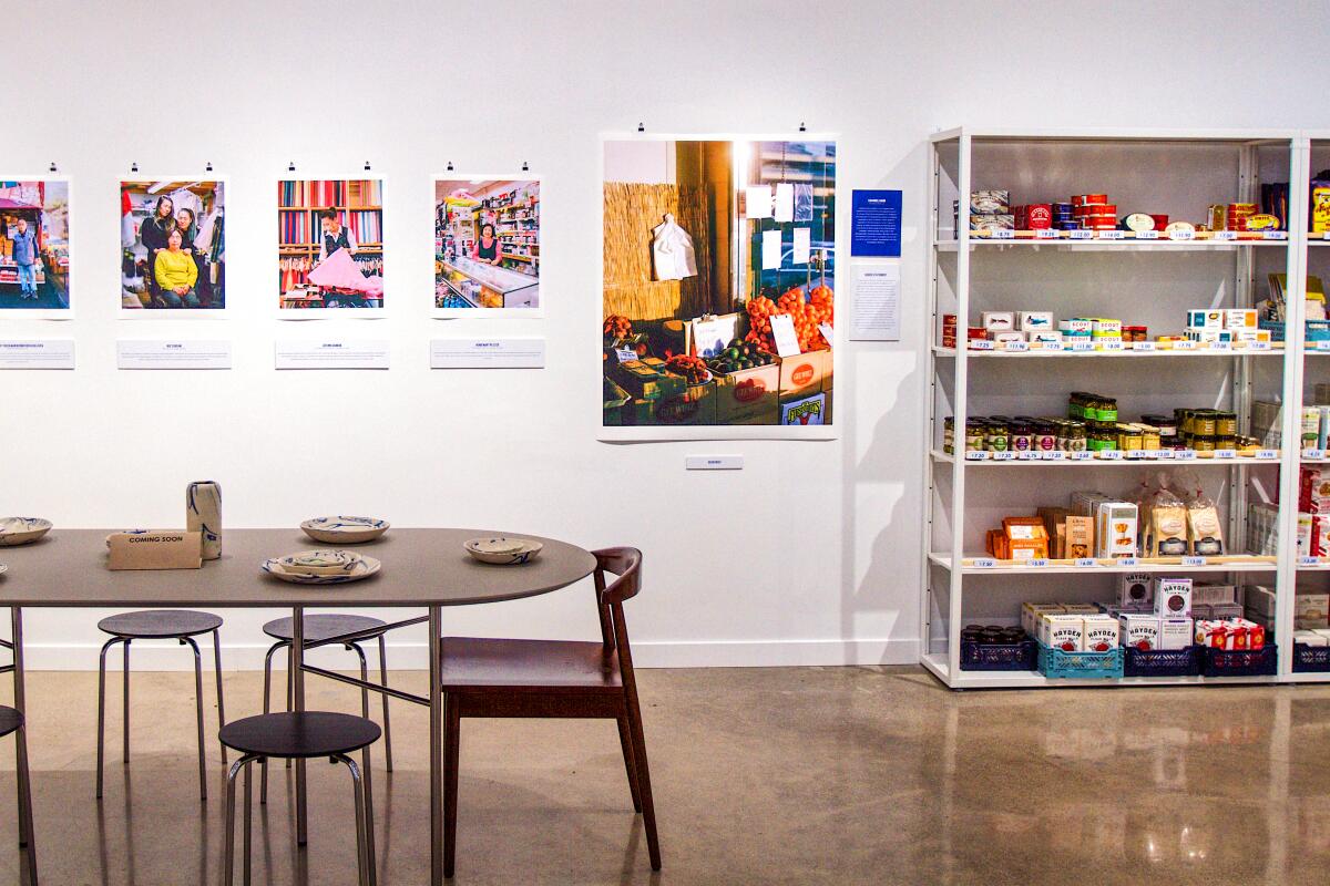 The interior of Open Market, with dining spaces and pantry items.