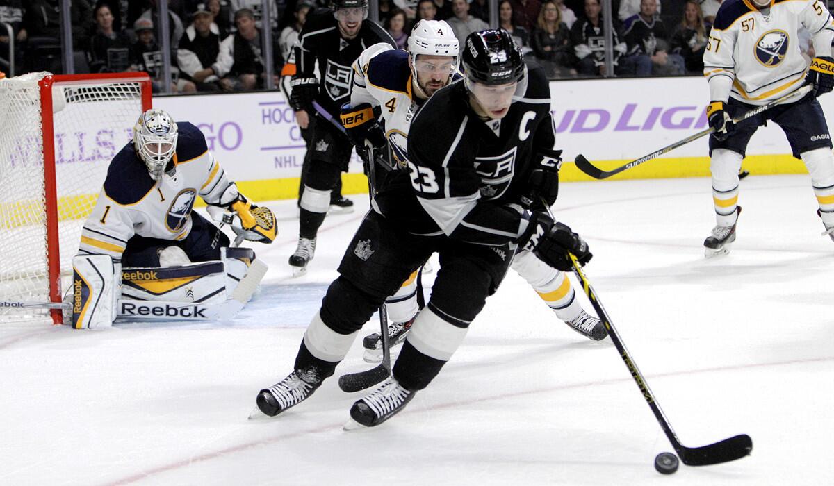 Right wing and captain Dustin Brown (23) controls the puck as the Kings go on the offensive against the Buffalo Sabres in a 2-0 victory on Thursday night.