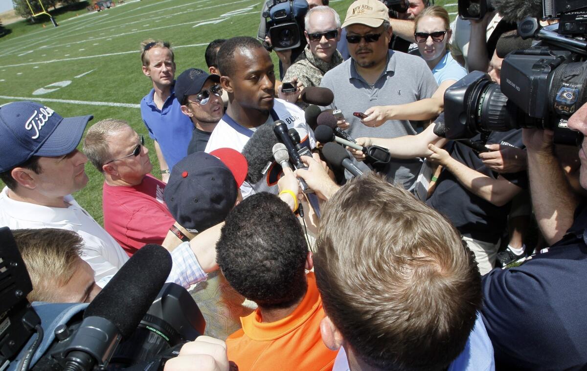 Running back Willis McGahee talks with reporters after taking part in Denver's mandatory mini-camp Tuesday, two days before being released by the team.