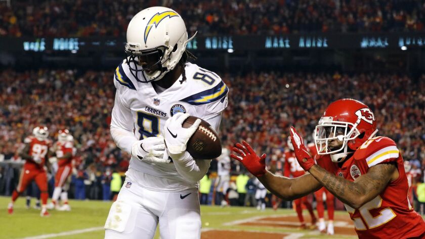 Wide receiver Mike Williams of the Los Angeles Chargers catches a pass for a last-second touchdown as defensive back Orlando Scandrick of the Kansas City Chiefs defends during game at Arrowhead Stadium on Thursday night.