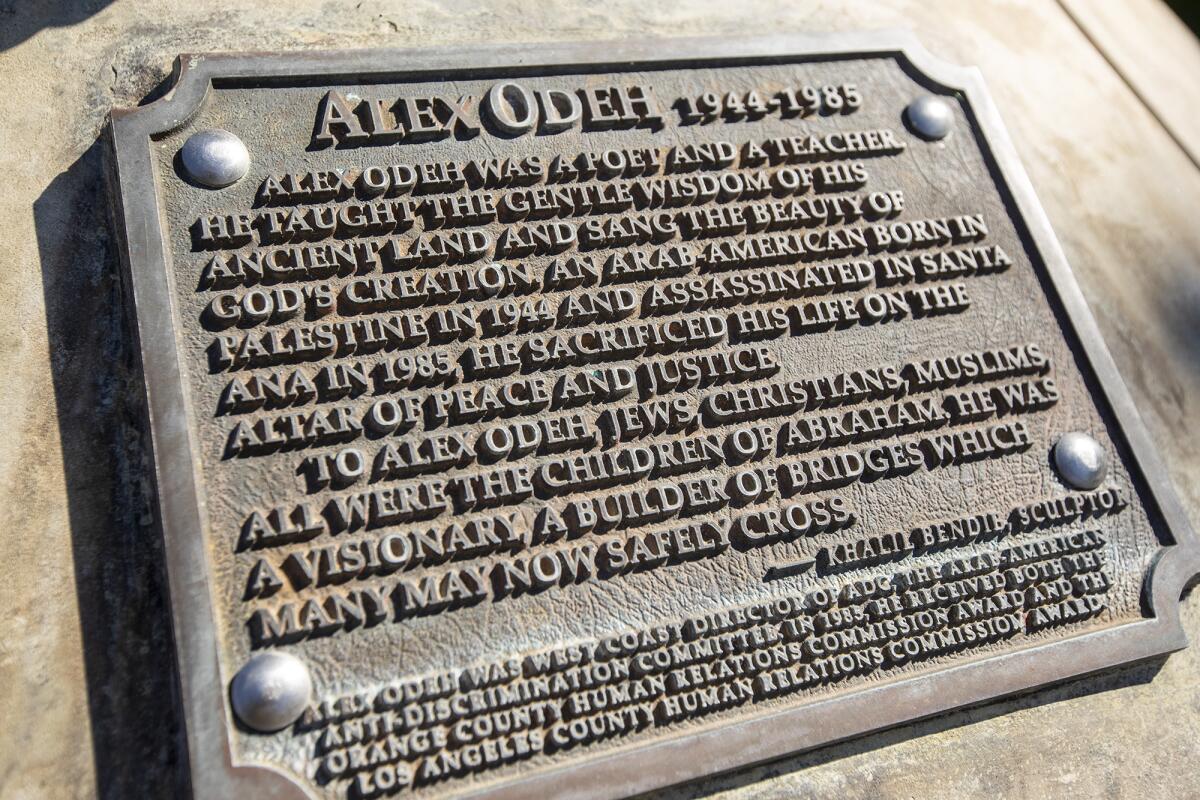A closeup of a statue plate that reads "Alex Odeh, 1944-1985," and words beneath