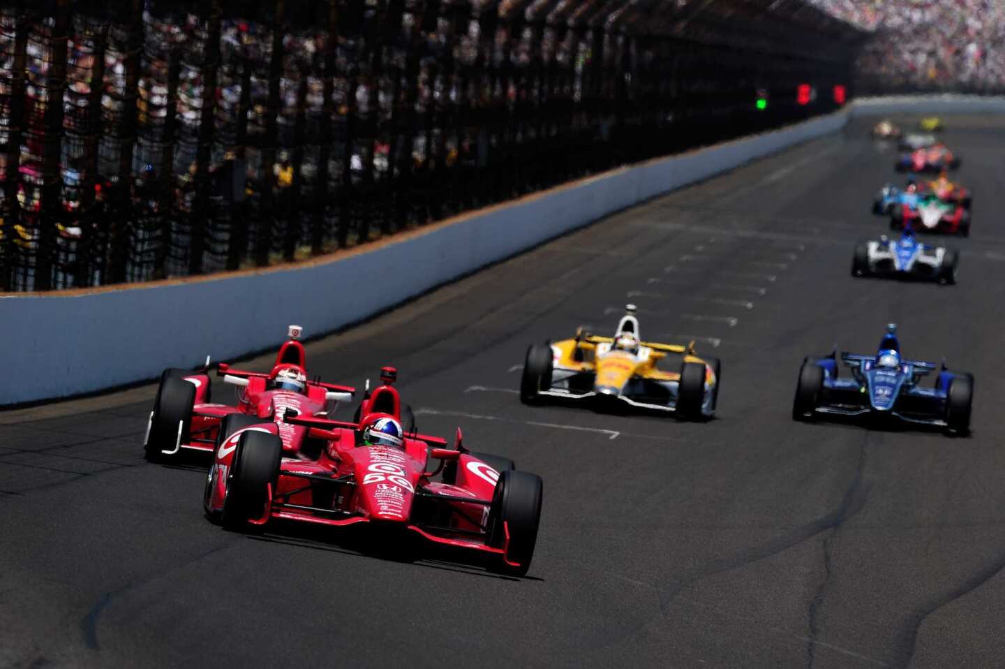 Dario Franchitti leads Target Chip Ganassi Racing Honda teammate Scott Dixon into Turn 1 during the 96th Indianapolis 500 on Sunday.