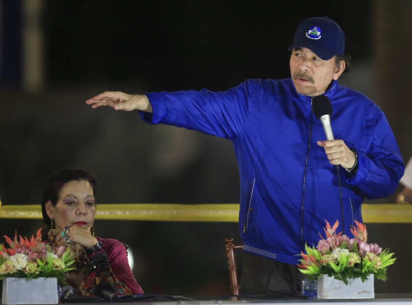 FILE - In this March 21, 2019 file photo, Nicaragua's President Daniel Ortega speaks next to first lady and Vice President Rosario Murillo during the inauguration ceremony of a highway overpass in Managua, Nicaragua. Nicaragua’s National Police have arrested on Tuesday, June 8, 2021, two more potential challengers to President Ortega, the third and fourth opposition pre-candidates for the Nov. 7 elections detained in the past week. (AP Photo/Alfredo Zuniga, File)