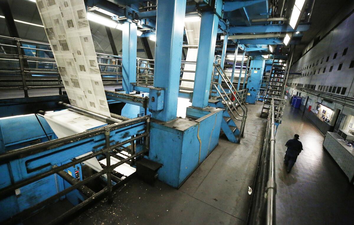 Newspapers on a printing press