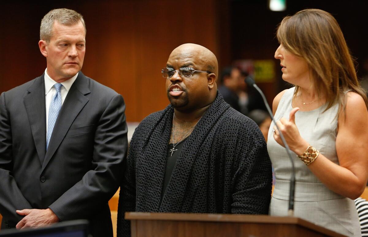 Cee Lo Green, a.k.a. Thomas DeCarlo Callaway, center, with attorneys Thomas P. O'Brien and Blair Berk, pleads not guilty to furnishing the party drug Molly to a woman last year while dining at a downtown Los Angeles restaurant. His arraignment was held at the Clara Shortridge Foltz Criminal Justice Center in Downtown Los Angeles on Oct. 21, 2013.
