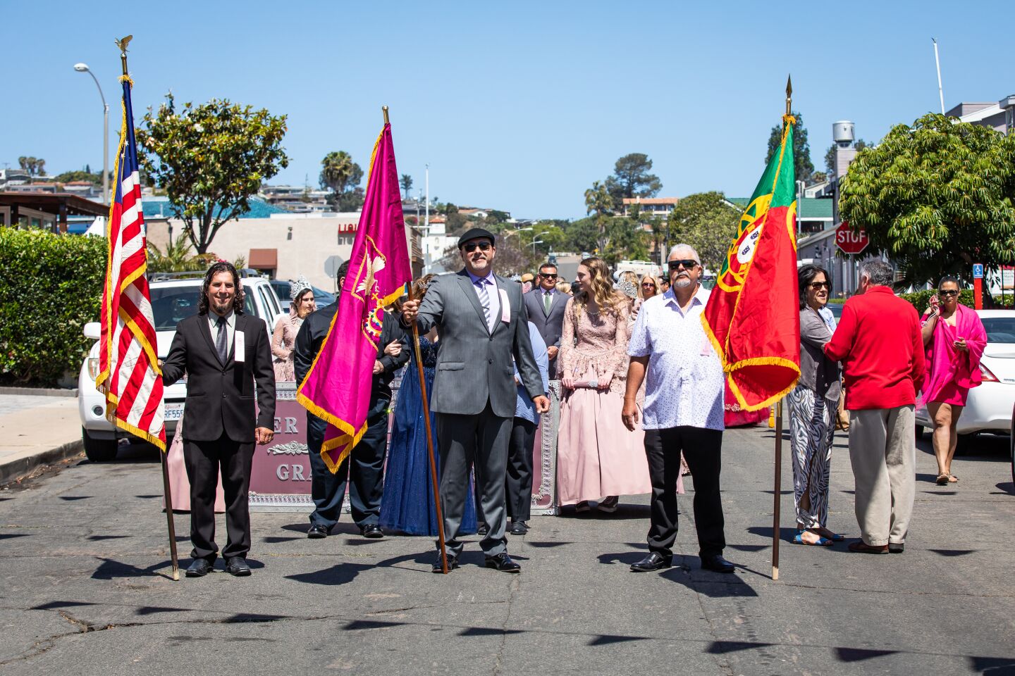 Jerry Balelo, Jose Virissimo and Manuel Virissimo carry the flags for the commemoration of Festa do Espirito Santo (Feast of the Holy Spirit), which the Point Loma Portuguese community has been celebrating since 1910 in honor of Queen St. Isabel of Portugal.