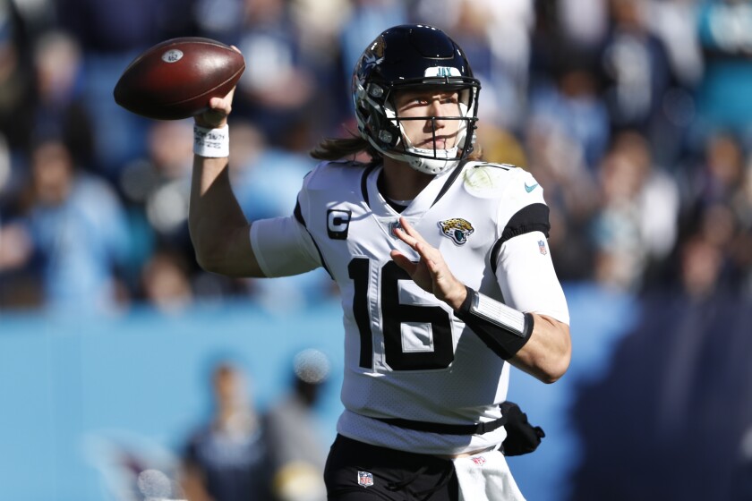 Jacksonville Jaguars quarterback Trevor Lawrence (16) passes in the pocket against the Tennessee Titans during the first half of an NFL football game, Sunday, Dec. 12, 2021, in Nashville, Tenn. (AP Photo/Wade Payne)