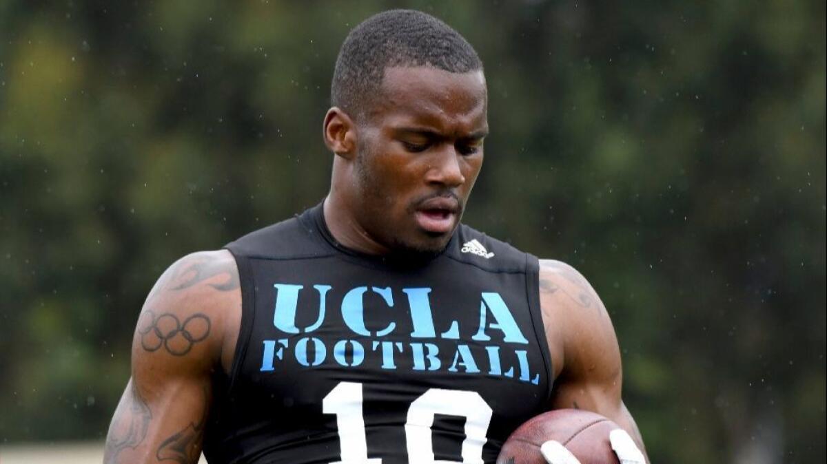 UCLA receiver Kenneth Walker III runs upfield after catching the ball during UCLA's pro day.