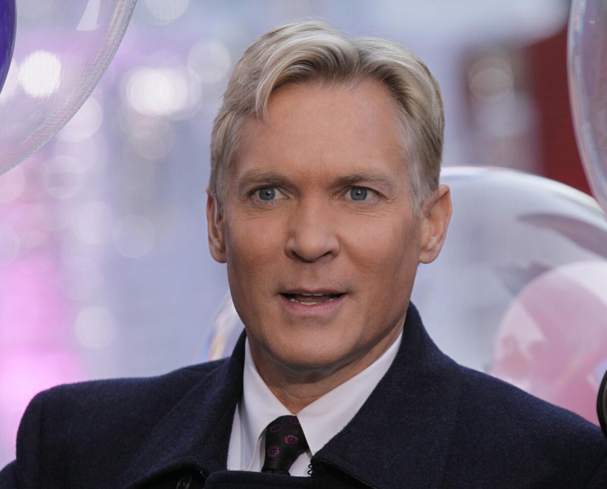 An Oct. 17, 2012 photo shows Sam Champion, then the weather anchor of ABC's "Good Morning America" program, in New York's Times Square.