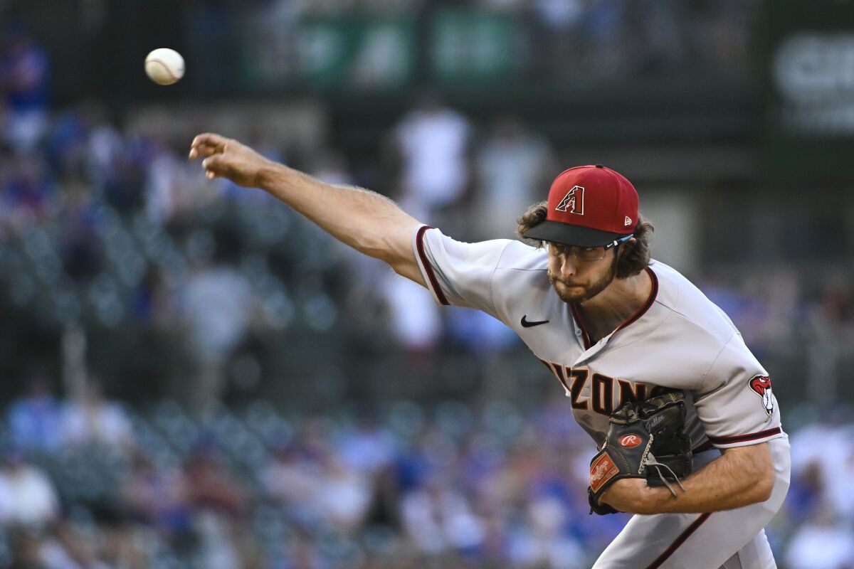 Arizona Diamondbacks starting pitcher Zac Gallen throws to a Chicago Cubs batter during the first inning of a baseball game in Chicago, Thursday, May 19, 2022. (AP Photo/Matt Marton)
