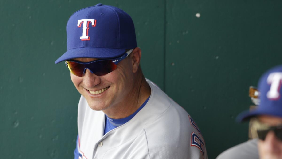 Texas Rangers Manager Jeff Banister smiles in the dugout during the eighth inning of a win over the Kansas City Royals on June 6.